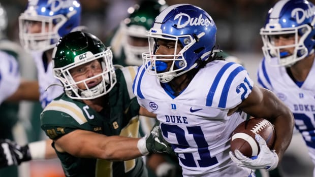Duke Blue Devils running back Mataeo Durant (21) is tackled by Charlotte 49ers linebacker Luke Martin (17) during the second quarter at Jerry Richardson Stadium. Jim Dedmon-USA TODAY Sports